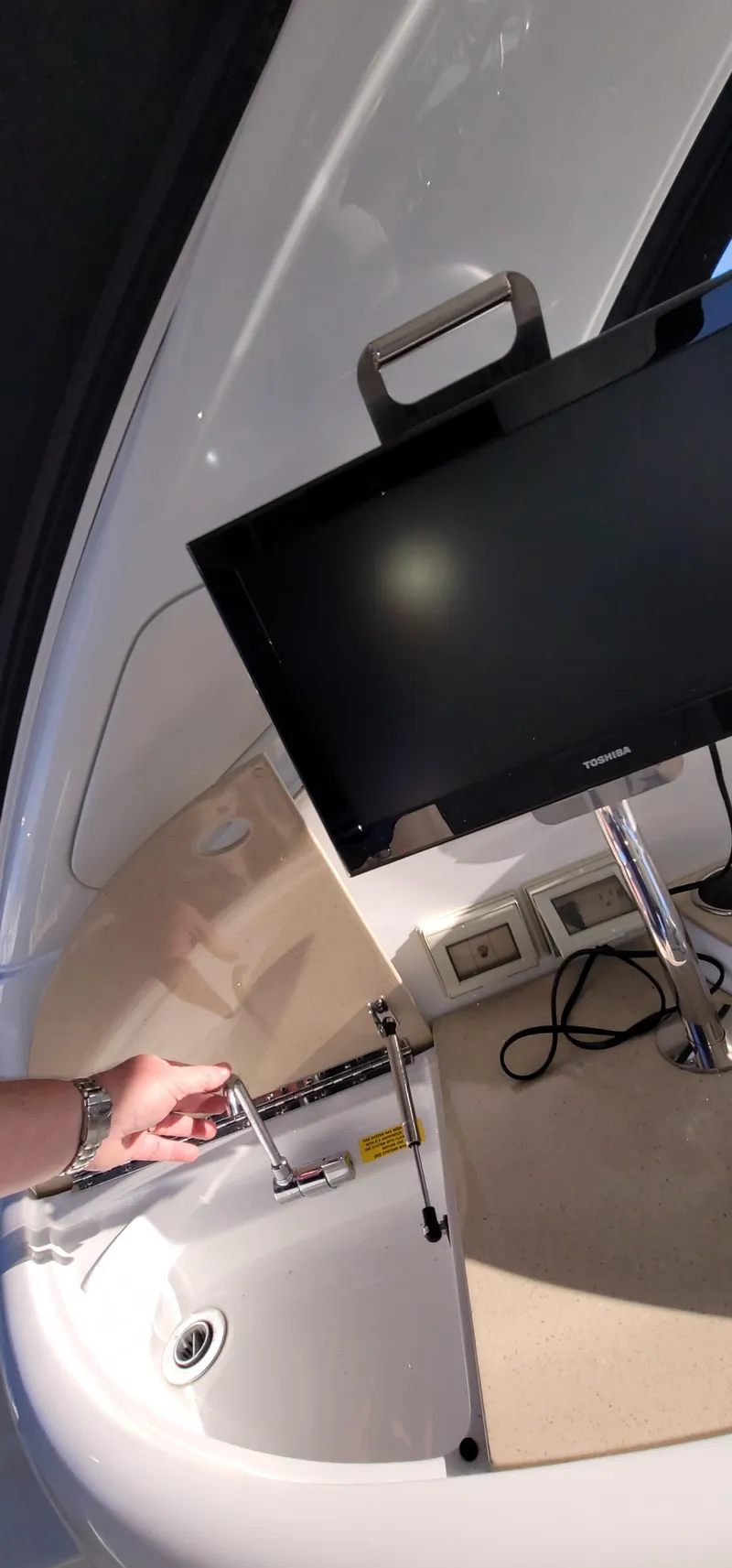 Slide: The Image of 2012 Formula 37 Performance Cruiser interior with TV and sink. - 16