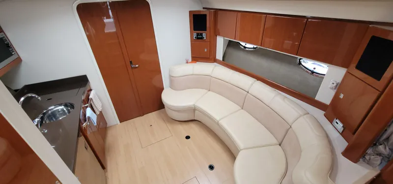Slide: The Image of Interior of a 2012 Formula 37 Performance Cruiser with leather sofa and wooden cabinetry. - 35