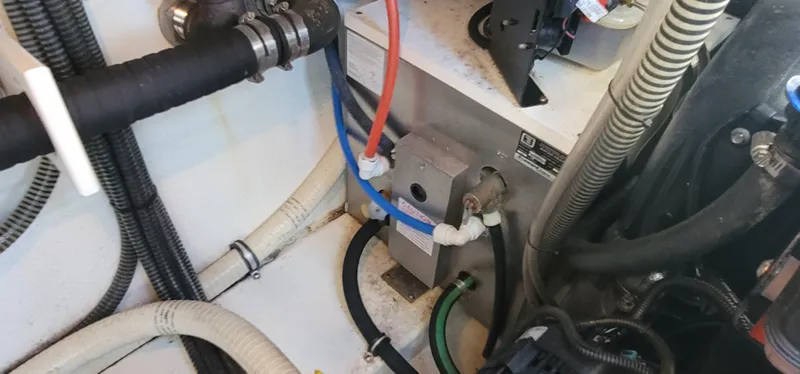 Slide: The Image of Engine compartment of a 2012 Formula 37 Performance Cruiser with hoses and cables. - 48