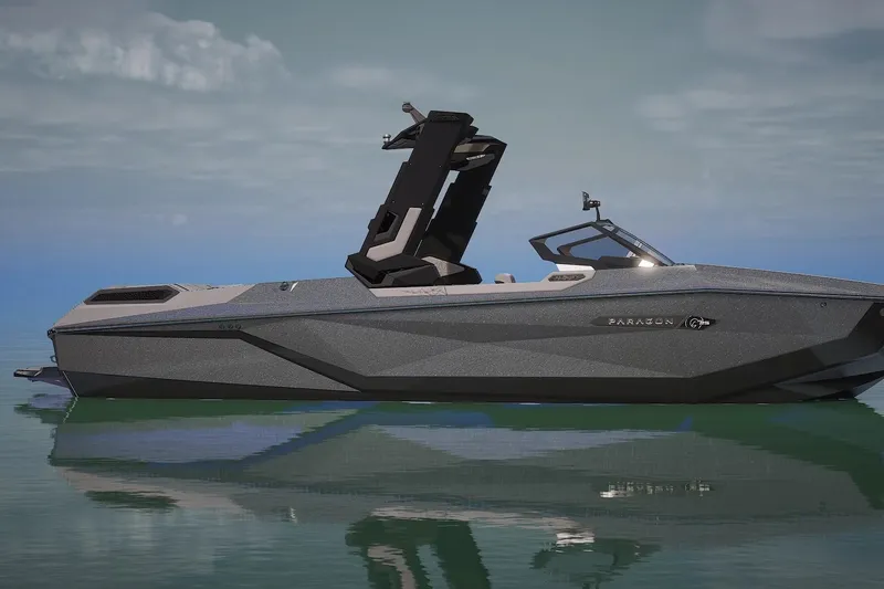 Slide: The Image of 2026 Nautique Super Air Nautique G25 Paragon on calm water, showcasing sleek design. - 1