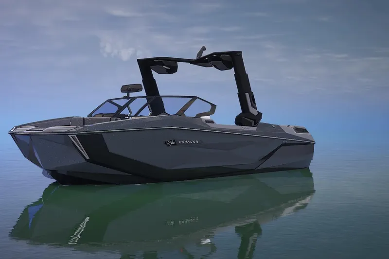 Slide: The Image of 2026 Nautique Super Air Nautique G25 Paragon boat on calm water. - 2