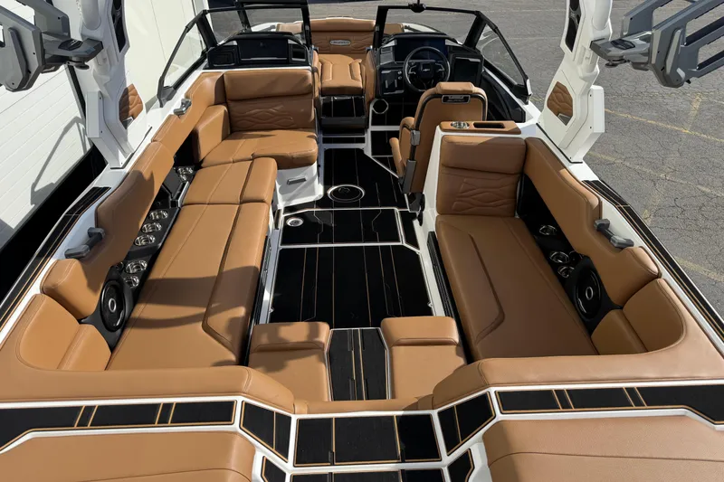 Slide: The Image of 2026 Supra SL 575 boat interior with luxurious tan leather seating and modern design. - 11