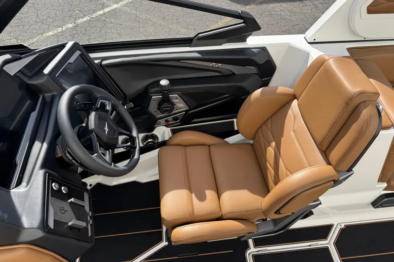 Slide: The Image of 2026 Supra SL 575 interior with tan leather seat and modern steering wheel design. - 8
