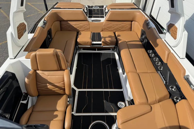 Slide: The Image of Luxurious interior of 2026 Supra SL 575 boat with tan leather seating. - 9