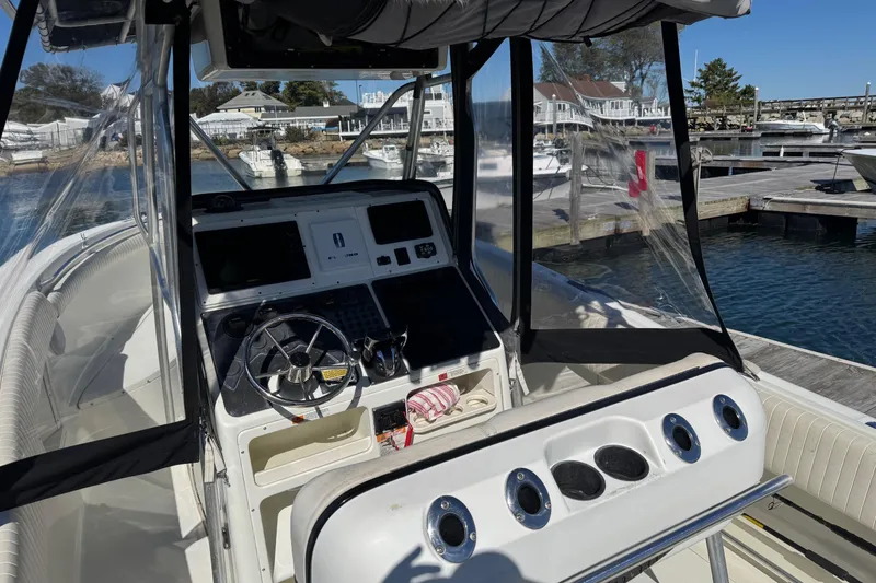 Slide: The Image of 2001 Hydra-Sports Vector 2390 CC boat cockpit with steering wheel and control panel. - 6