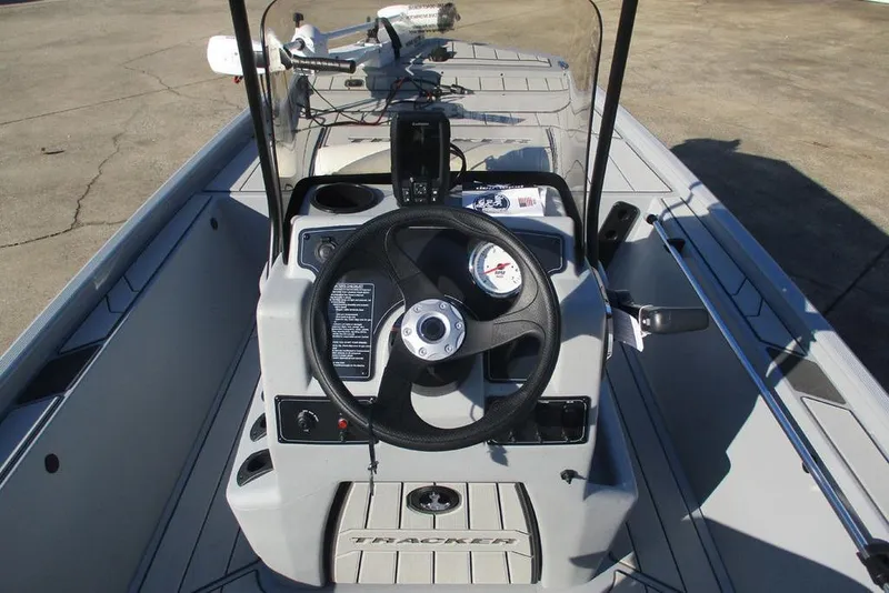 Slide: The Image of 2026 Tracker Bass Tracker Classic CC boat console with steering wheel and navigation equipment. - 3