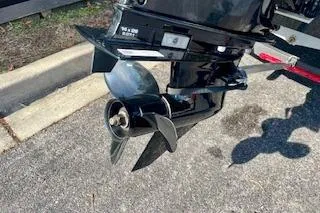 Slide: The Image of 2025 Tracker Pro Team 175 TXW boat motor propeller on pavement. - 15