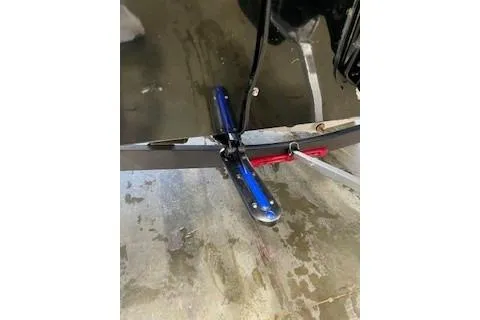 Slide: The Image of 2025 Tracker Pro Team 175 TXW boat detail, showing a blue and red component on a wet surface. - 17