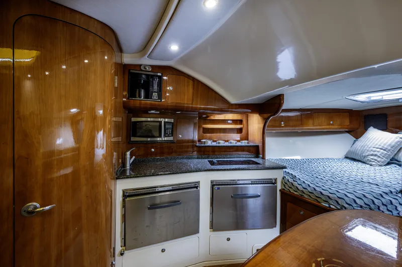 Slide: The Image of Luxurious interior of 2010 Scout 350 Abaco boat with kitchenette and cozy sleeping area. - 10