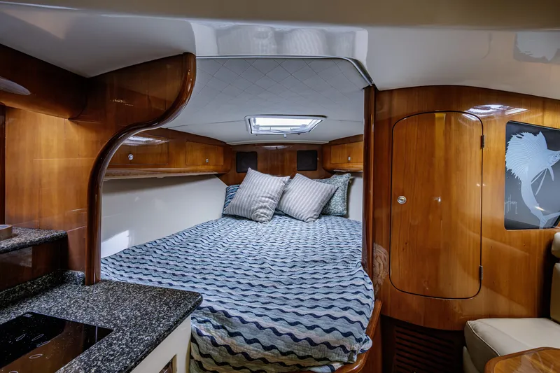 Slide: The Image of Luxurious cabin interior of 2010 Scout 350 Abaco boat with cozy bedding. - 12
