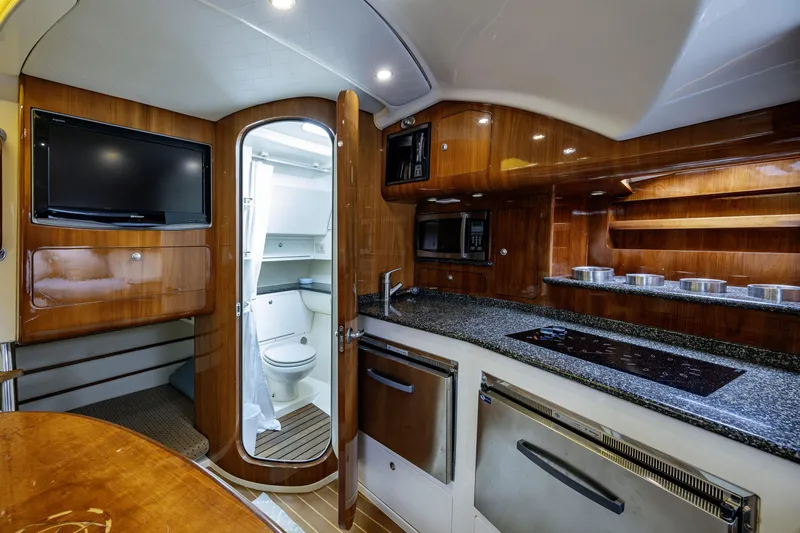 Slide: The Image of Luxurious 2010 Scout 350 Abaco yacht interior with modern kitchen and bathroom amenities. - 14