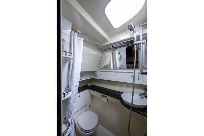 Slide: The Image of Compact bathroom in 2010 Scout 350 Abaco boat with shower, sink, and toilet. - 15