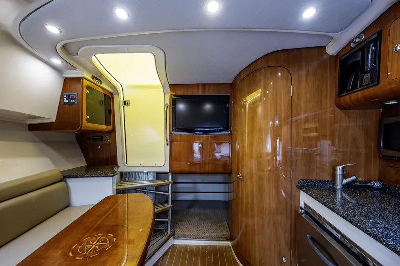 Slide: The Image of Luxurious interior of 2010 Scout 350 Abaco boat with wood finish and modern amenities. - 17