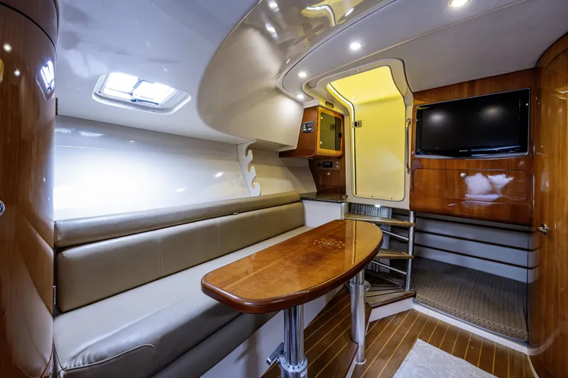 Slide: The Image of Luxurious interior of 2010 Scout 350 Abaco boat with seating, table, and TV. - 18