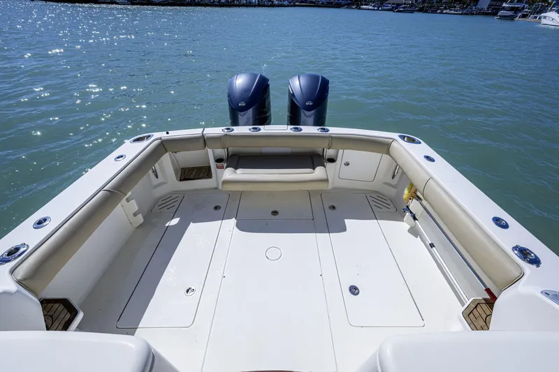 Slide: The Image of 2010 Scout 350 Abaco boat deck with dual engines on calm water. - 20