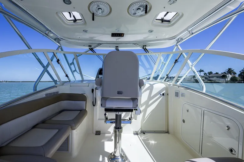 Slide: The Image of Interior view of 2010 Scout 350 Abaco boat with seating and helm. - 26