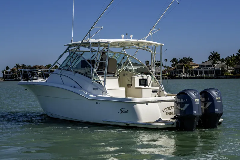 Slide: The Image of 2010 Scout 350 Abaco boat with twin Yamaha V8 engines on calm water. - 43