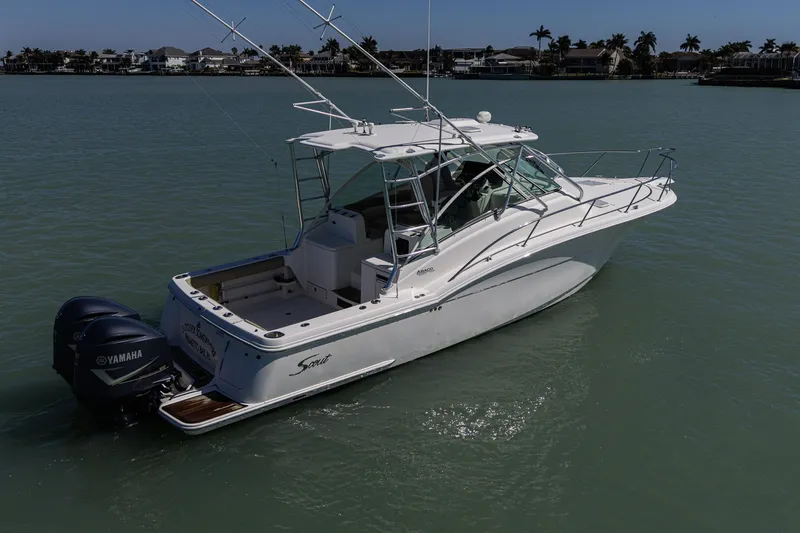 Slide: The Image of 2010 Scout 350 Abaco boat with Yamaha engines on calm water. - 7