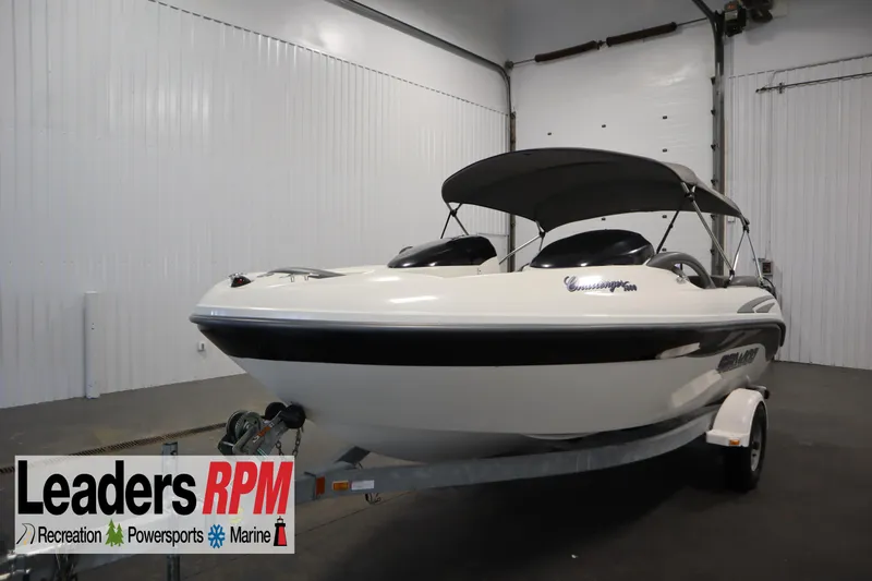 The Image of 2001 Sea-Doo Challenger 1800 boat in showroom, featuring sleek design and canopy. - 0