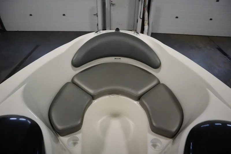 Slide: The Image of 2001 Sea-Doo Challenger 1800 boat interior with gray cushioned seating. - 10