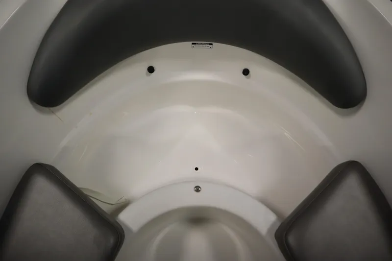 Slide: The Image of Interior seating of 2001 Sea-Doo Challenger 1800 boat, featuring gray cushions. - 11