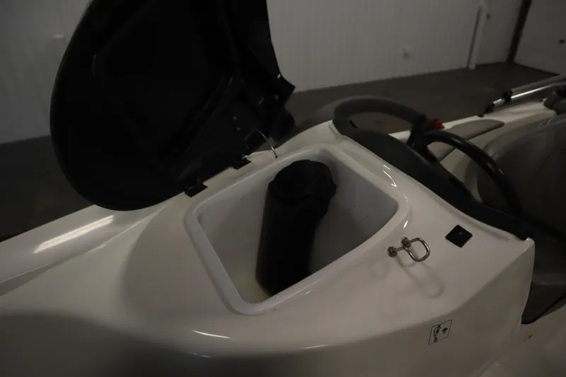 Slide: The Image of Open storage compartment on 2001 Sea-Doo Challenger 1800 boat, showcasing interior details. - 13