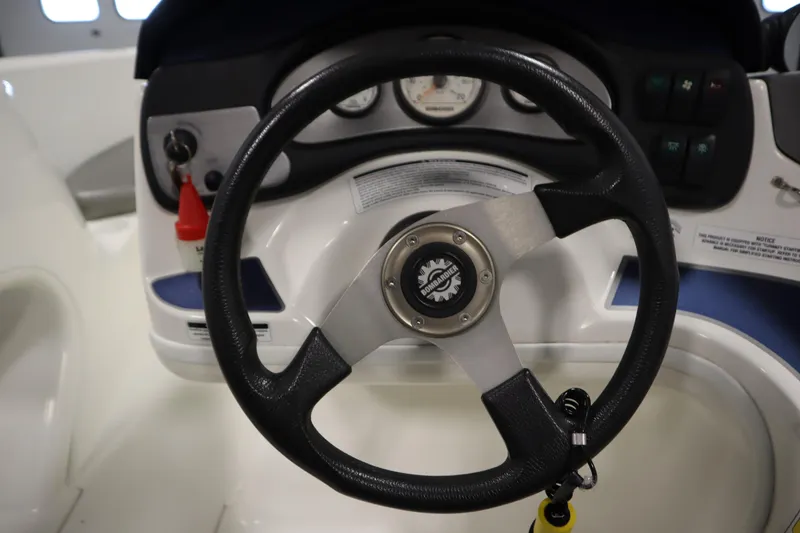 Slide: The Image of 2001 Sea-Doo Challenger 1800 steering wheel and dashboard controls. - 15