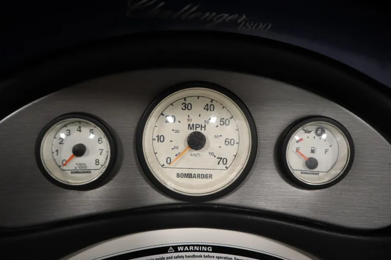 Slide: The Image of Dashboard of 2001 Sea-Doo Challenger 1800 with speedometer, tachometer, and fuel gauge. - 16