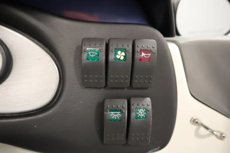 Slide: The Image of Dashboard switches on a 2001 Sea-Doo Challenger 1800 boat. - 17