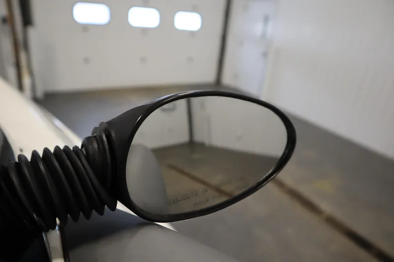 Slide: The Image of Side mirror of 2001 Sea-Doo Challenger 1800 in a garage setting. - 19