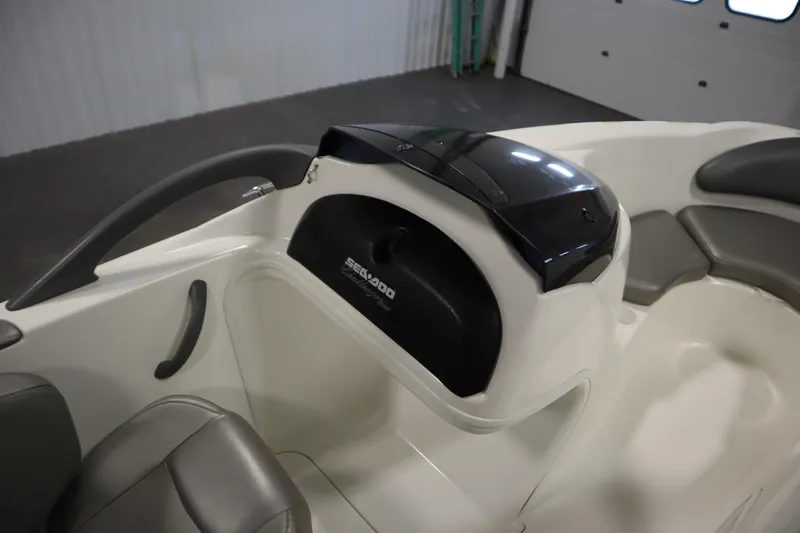 Slide: The Image of 2001 Sea-Doo Challenger 1800 boat interior with seating and storage compartment. - 22