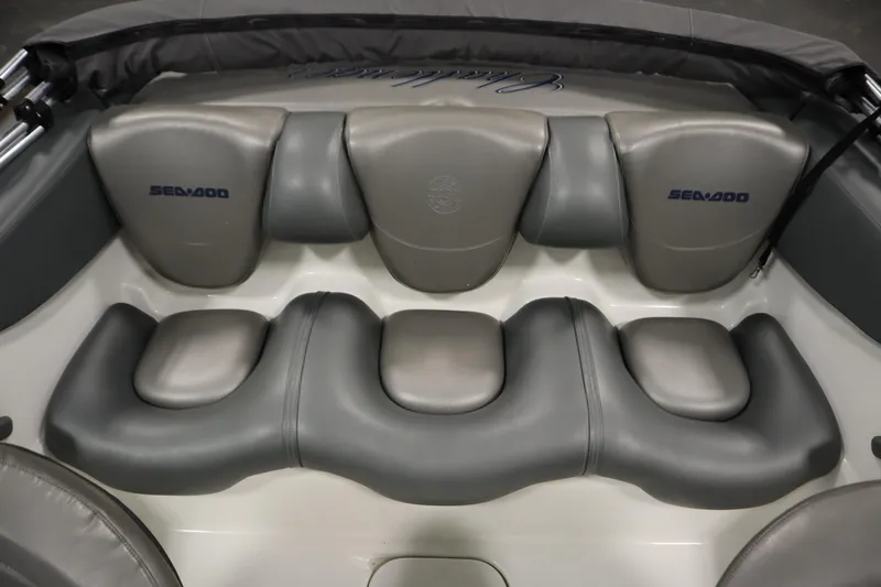 Slide: The Image of 2001 Sea-Doo Challenger 1800 boat interior with gray cushioned seating. - 27