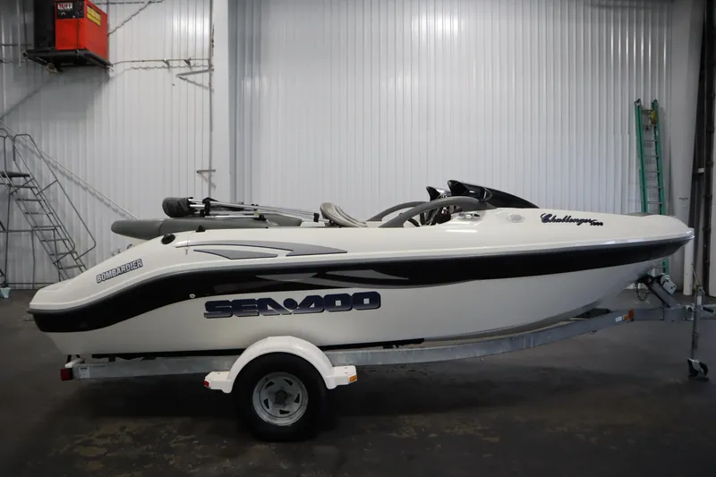 Slide: The Image of 2001 Sea-Doo Challenger 1800 boat on trailer in indoor storage facility. - 3