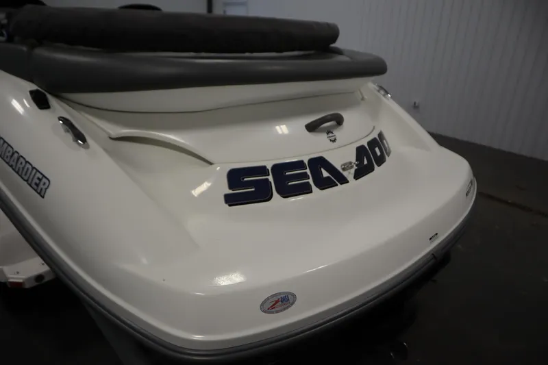 Slide: The Image of 2001 Sea-Doo Challenger 1800 boat rear view, featuring bold branding and sleek design. - 32