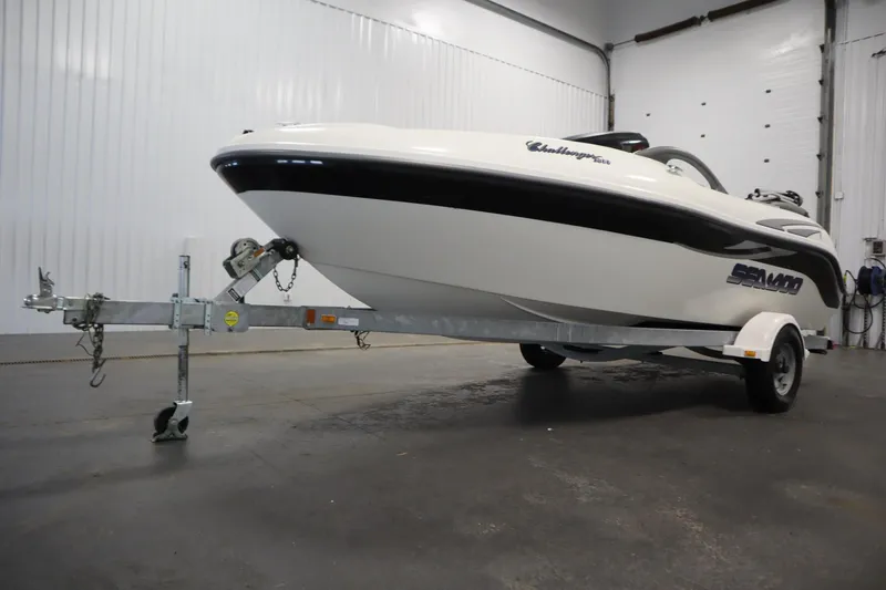 Slide: The Image of 2001 Sea-Doo Challenger 1800 boat on trailer in indoor storage facility. - 34