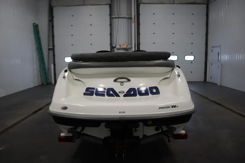 Slide: The Image of 2001 Sea-Doo Challenger 1800 boat in a garage, rear view. - 5