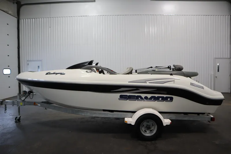 Slide: The Image of 2001 Sea-Doo Challenger 1800 boat on trailer in indoor storage facility. - 7