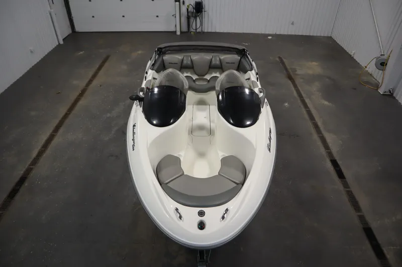Slide: The Image of 2001 Sea-Doo Challenger 1800 boat in a garage, top view, white and gray interior. - 8