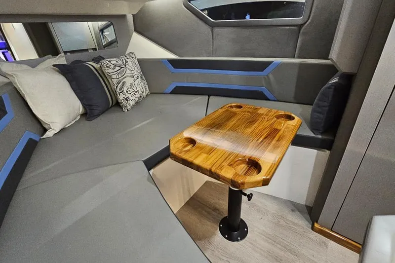 Slide: The Image of Modern interior of 2026 Hanover 327 with sleek seating and wooden table. - 16