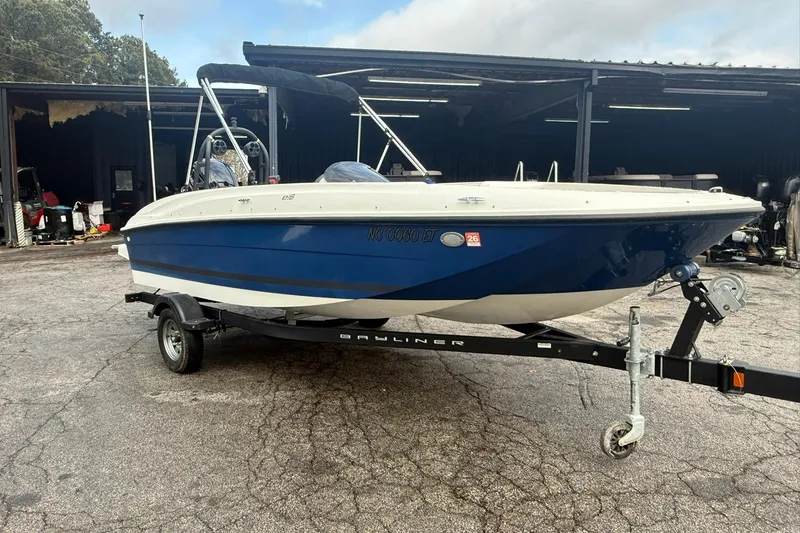 The Image of 2021 Bayliner Element E18 boat on trailer, parked outdoors. - 0