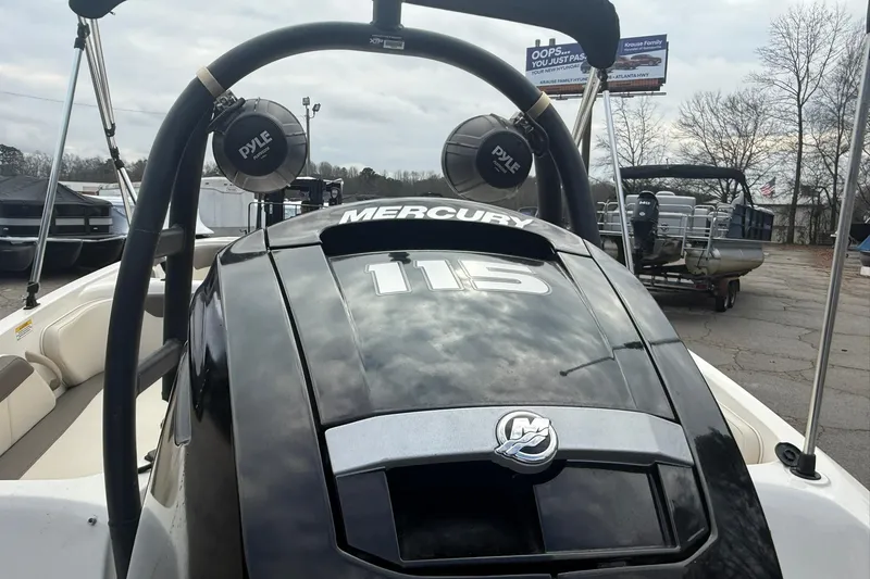 Slide: The Image of 2021 Bayliner Element E18 boat with Mercury 115 engine, outdoor setting. - 4
