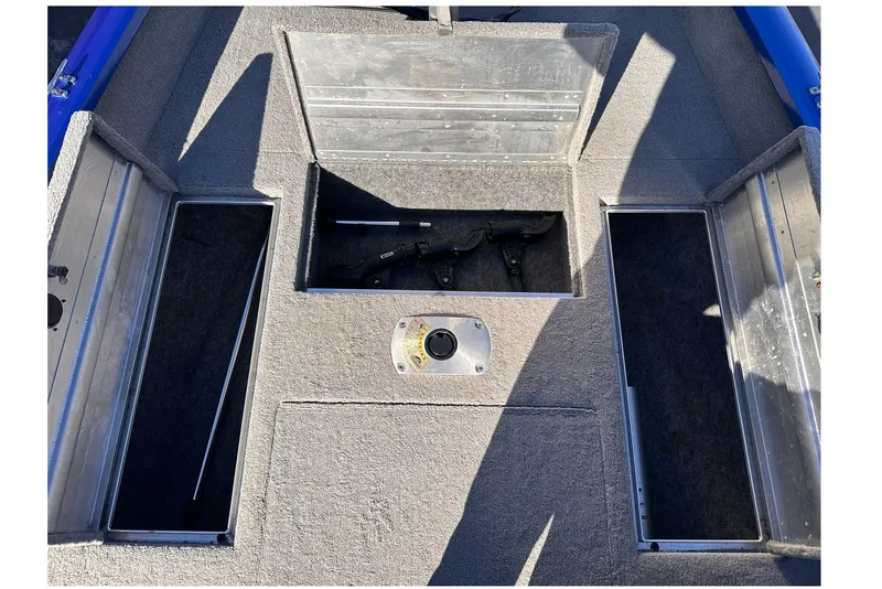 Slide: The Image of 2011 Tracker Pro Team 175 TF boat storage compartments with open hatches. - 12