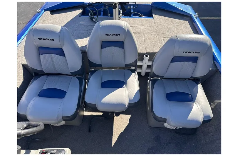 Slide: The Image of 2011 Tracker Pro Team 175 TF boat seats, gray and blue upholstery, three seats visible. - 17