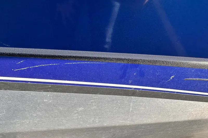 Slide: The Image of Close-up of 2011 Tracker Pro Team 175 TF boat with blue and gray detailing. - 23