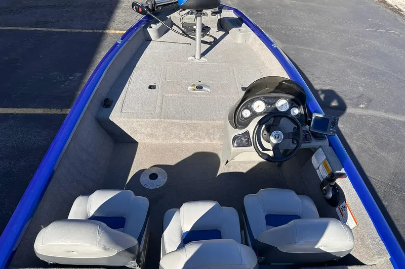 Slide: The Image of 2011 Tracker Pro Team 175 TF boat interior with steering console and seating. - 4