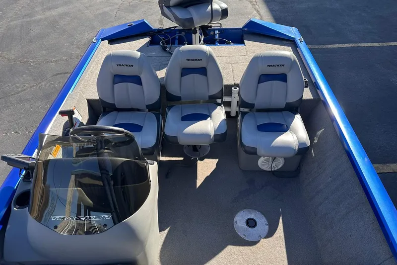 Slide: The Image of 2011 Tracker Pro Team 175 TF boat interior with three seats and steering console. - 5