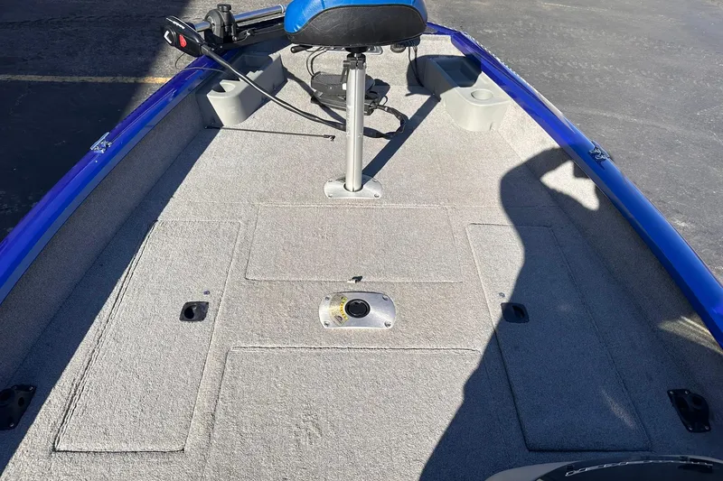 Slide: The Image of 2011 Tracker Pro Team 175 TF boat interior with blue trim and seating. - 6