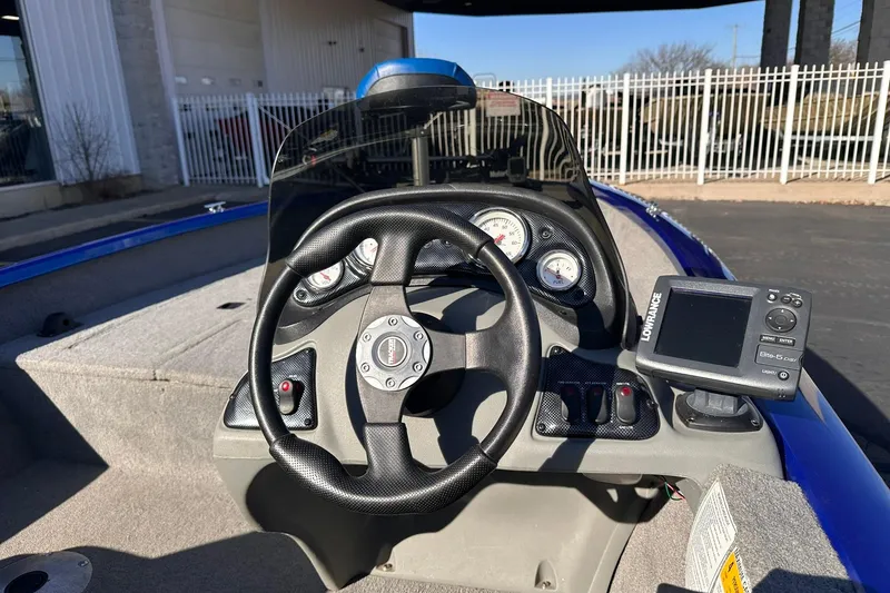 Slide: The Image of 2011 Tracker Pro Team 175 TF boat dashboard with steering wheel and Lowrance fishfinder. - 7