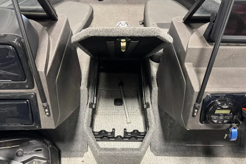 Slide: The Image of 2022 Tracker Targa V-18 WT boat interior with open storage compartment. - 20
