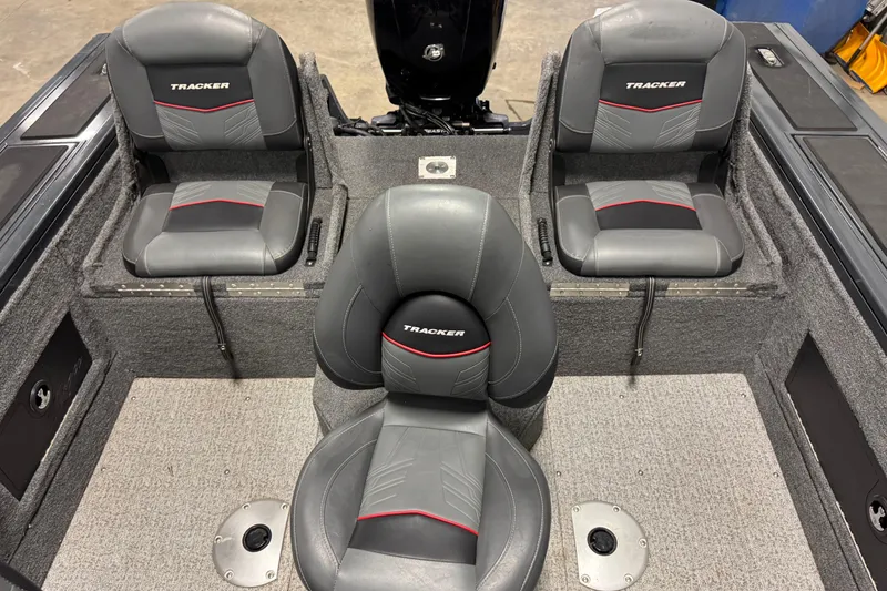 Slide: The Image of 2022 Tracker Targa V-18 WT boat interior with three gray seats. - 6